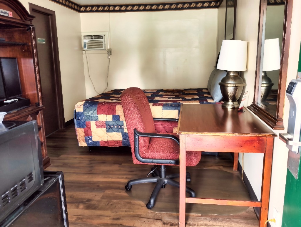 Clean, comfortable motel room interior at Delta Motel Bay City MI